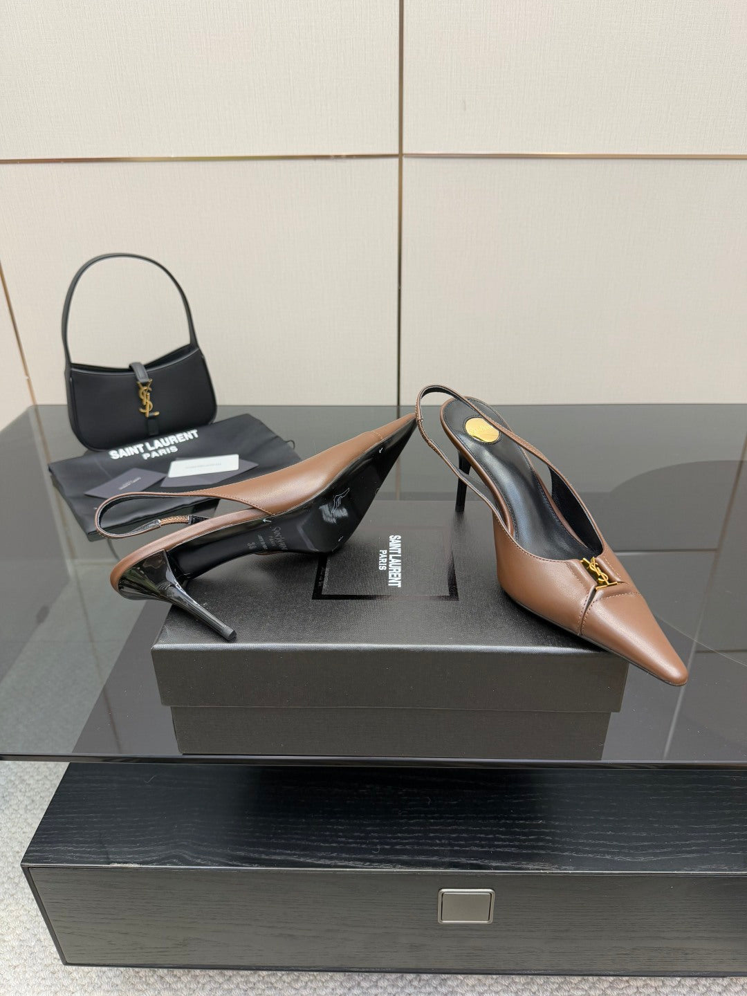 Brown slingback high-heel pumps with curved heel and black lining detail