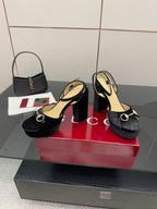 Black velvet platform sandals with silver ring hardware and chunky heel