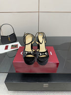 Black velvet platform heel sandals with silver ring hardware and ankle strap