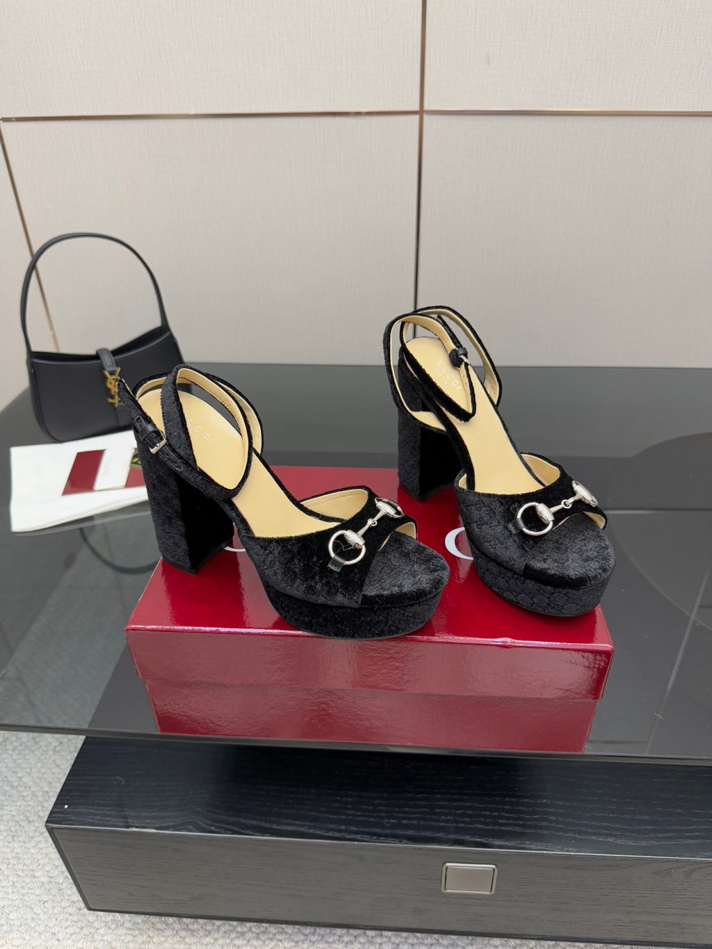 Pair of black velvet heeled sandals with silver ring detail and thick block heel