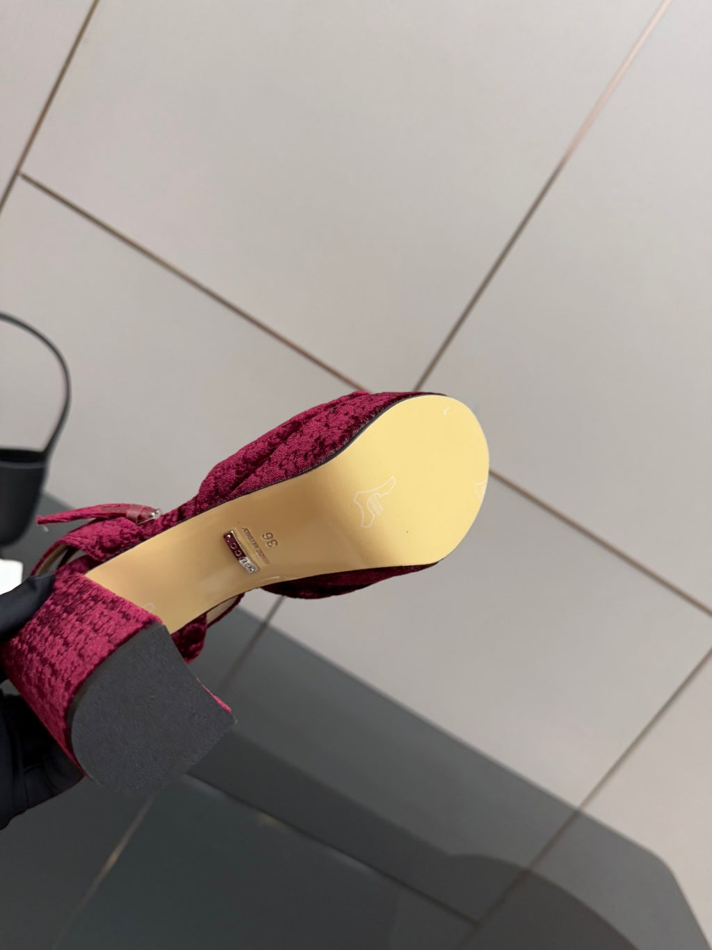Purple velvet platform shoe sole with tan insole and embossed logo