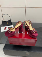 Purple velvet platform high-heel sandals with circular silver buckle on strap