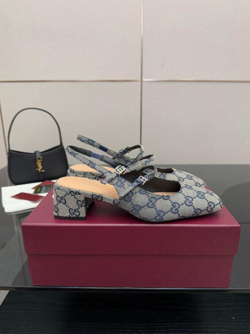 Blue GG monogram flats with bow buckle and slingback strap, close pair