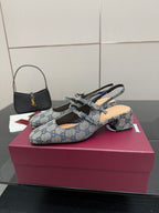 Side view of blue GG monogram flats with bow buckle and slingback strap
