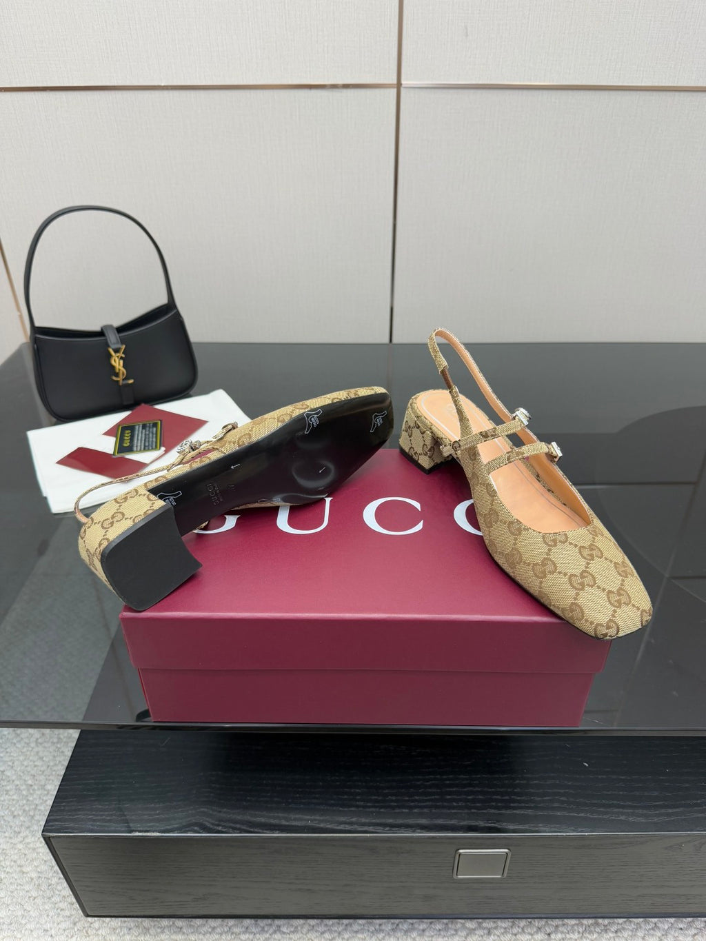 Gucci GG-pattern heeled mule with pointed toe and gold-toned strap details