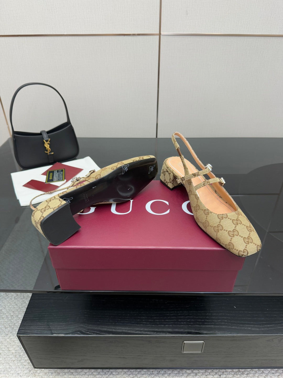 Gucci GG-pattern heeled mule with pointed toe and gold-toned strap details