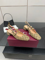 Gucci GG-pattern slip-on mule with pointed toe and multi-strap design