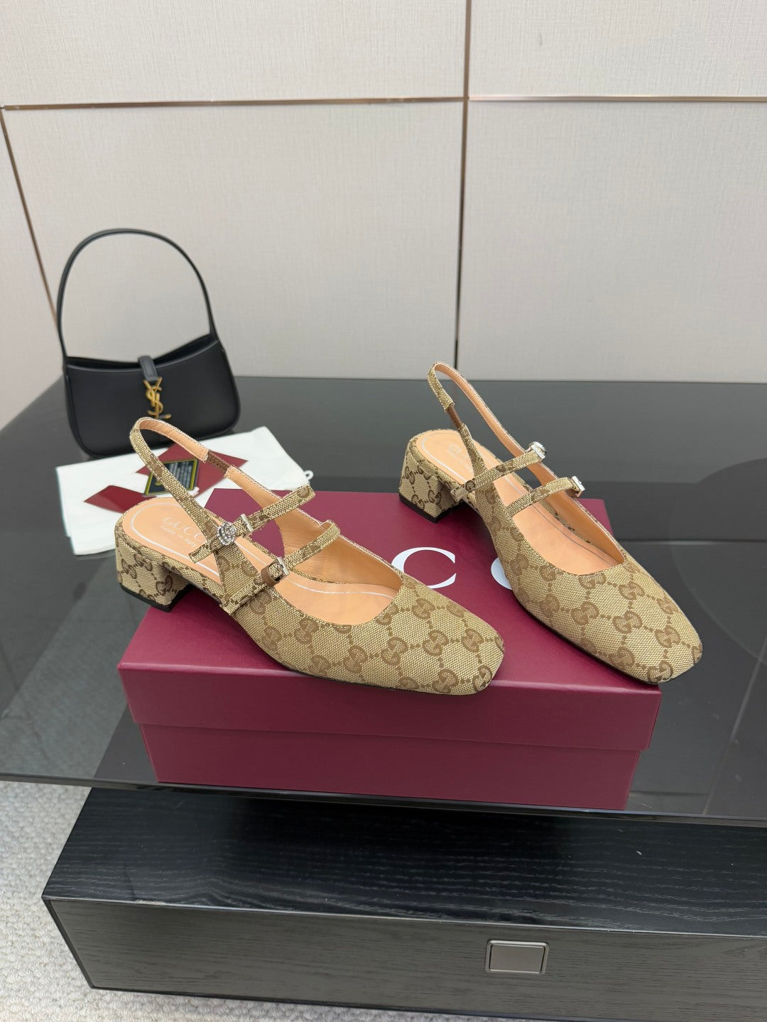 Gucci GG-pattern slip-on mule with pointed toe and multi-strap design