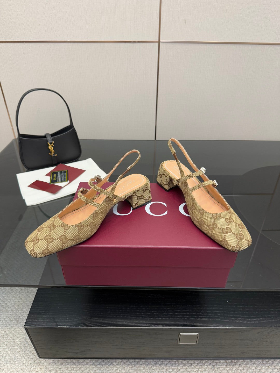 Gucci GG-pattern heeled mules with slim straps and gold buckle accents