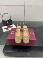 Gucci GG-pattern heeled mule with gold buckle straps, pointed toe