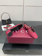 Gucci ladies slingback pumps, pink logo print, pair on box, ankle strap visible.