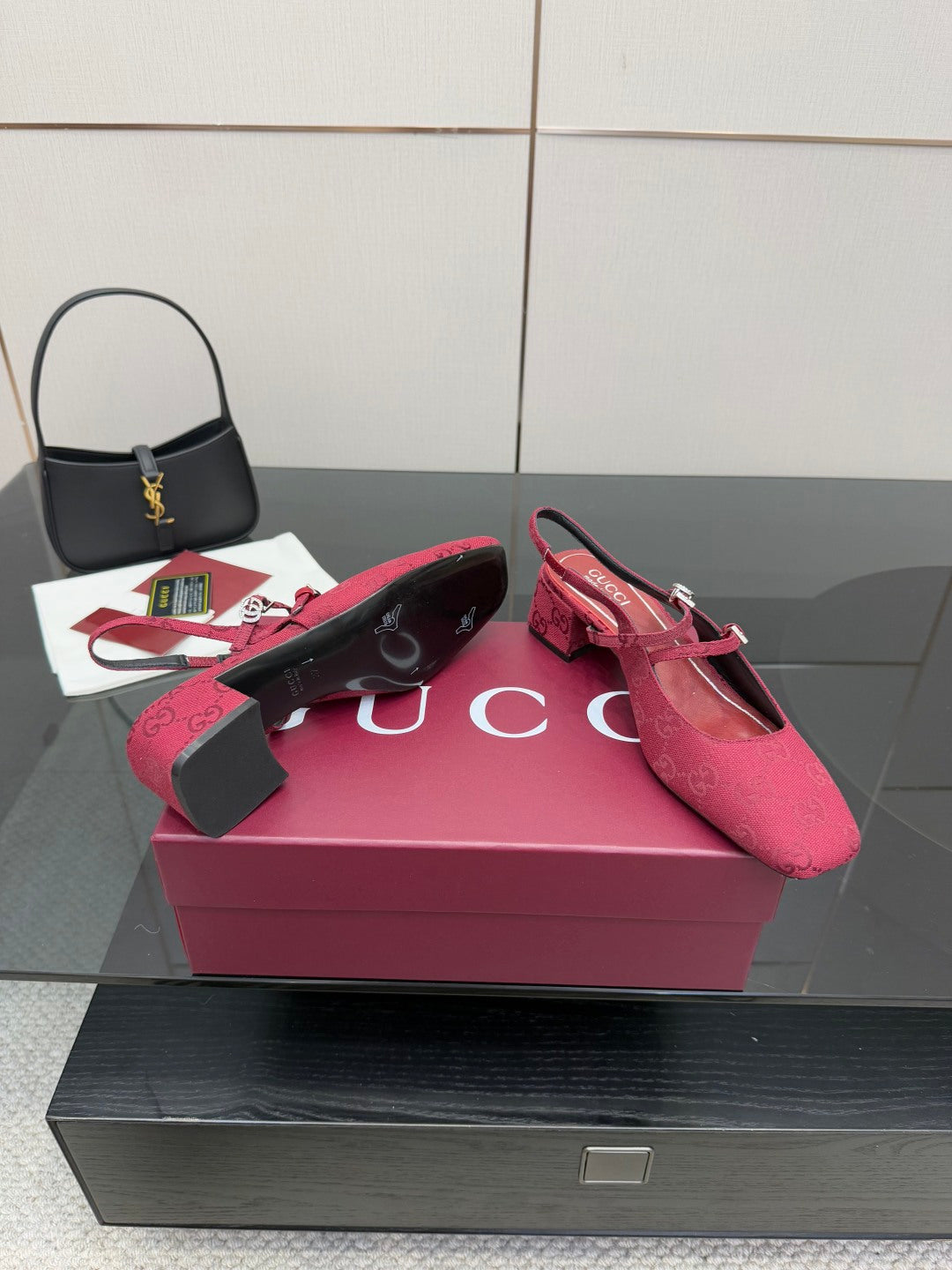 Gucci ladies slingback pumps, pink logo print, pair on box, ankle strap visible.