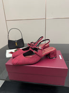 Gucci ladies slingback pumps, pink logo print, low block heel, side view.