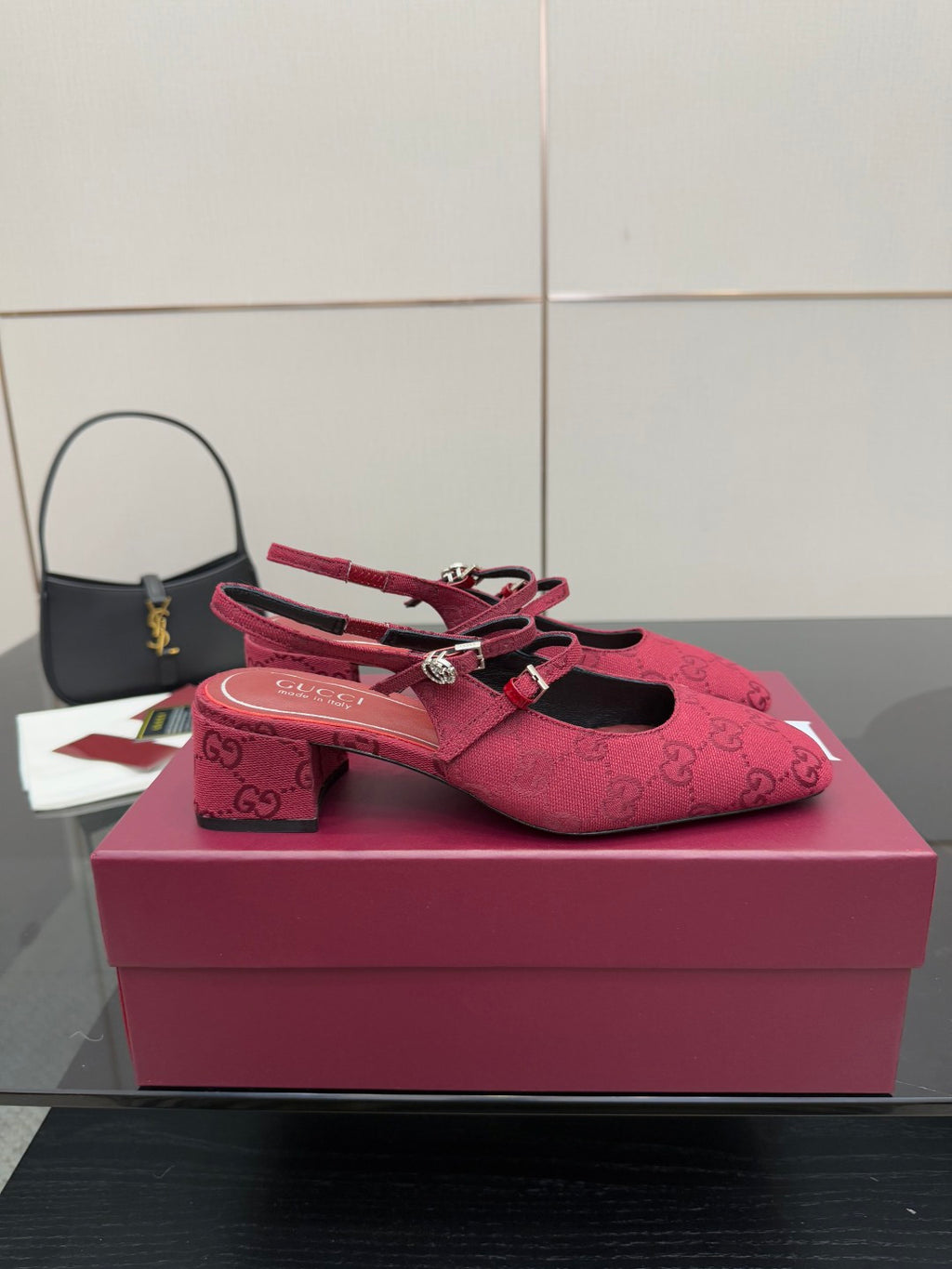 Gucci ladies slingback pumps, pink logo fabric, front view with block heel.