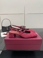 Gucci ladies slingback pumps, pink logo fabric, front view with block heel.