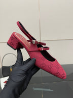 Gucci ladies slingback pumps, pink logo fabric, mid block heel, close-up.