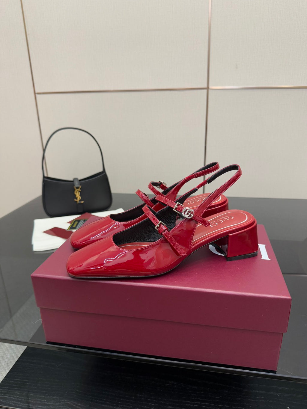 Gucci women’s red patent heels with bow strap detail and chunky block heel