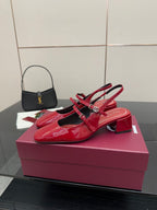 Gucci women’s red patent heels with bow strap detail and chunky block heel