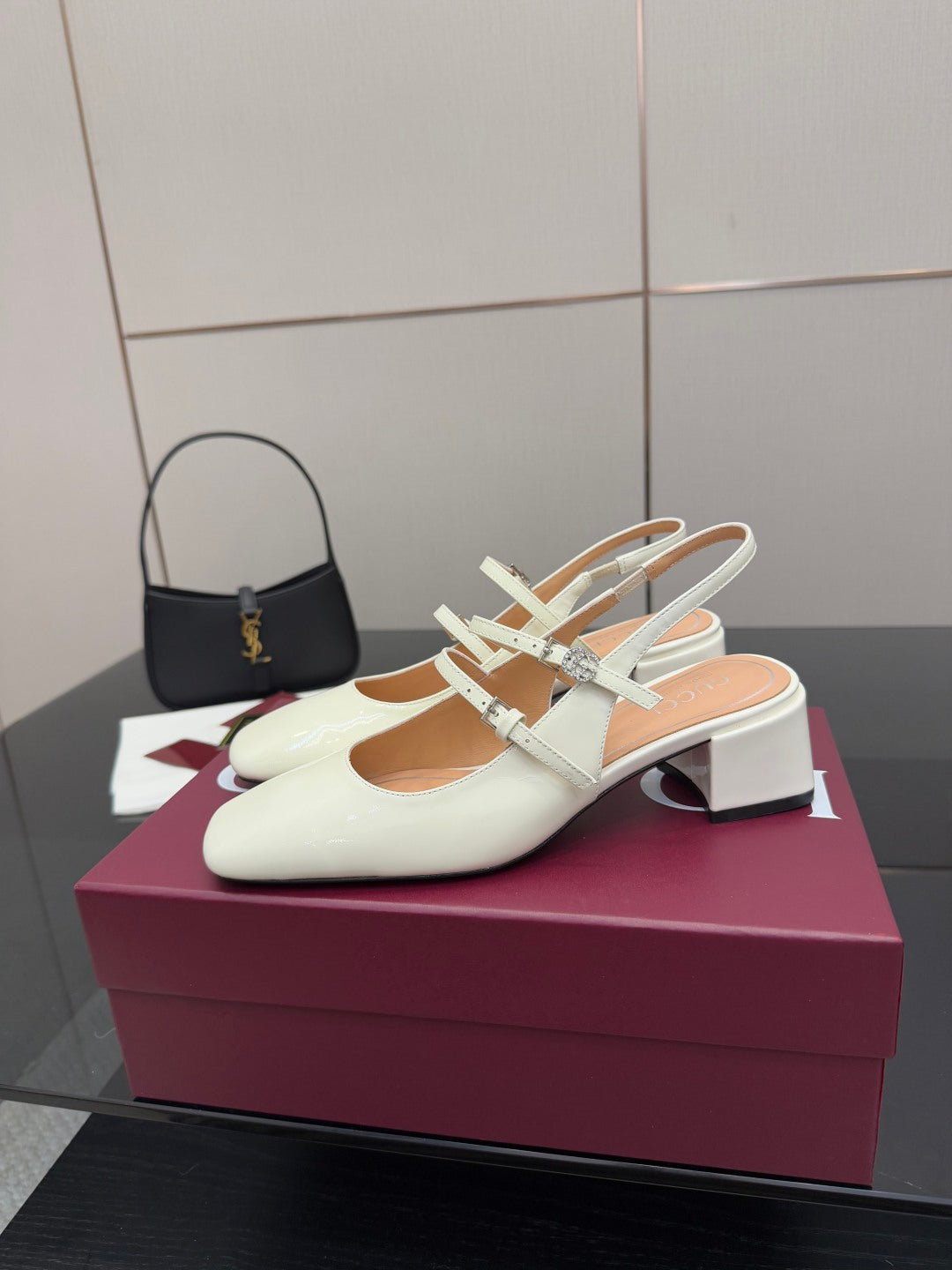 Gucci ladies' white pointed-toe slingback pumps with jeweled T-strap and block heel.