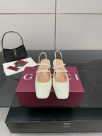 Gucci ladies' white slingback shoes with pointed toe, jeweled strap, block heel.
