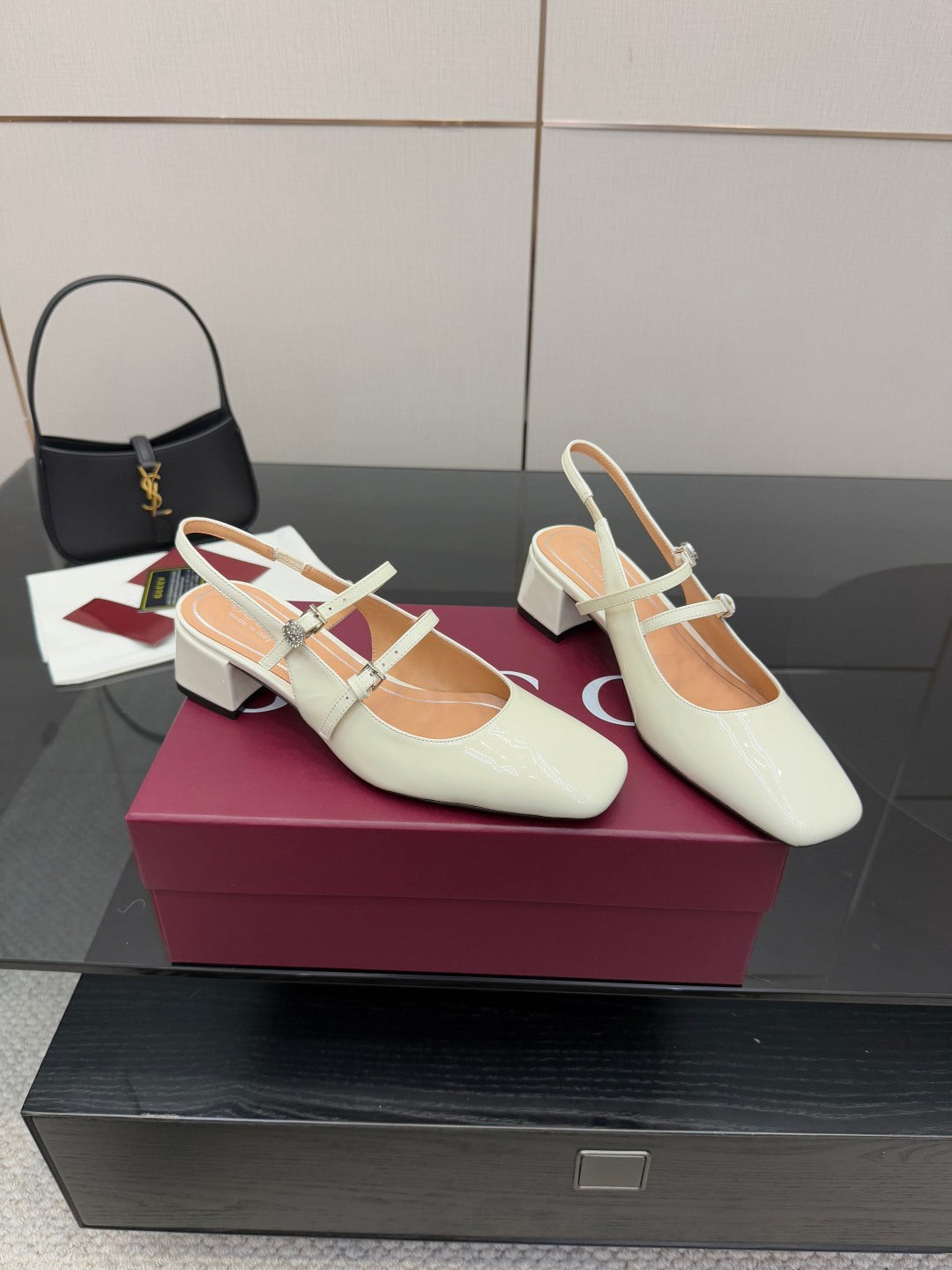 Gucci ladies' white pointed-toe slingback pumps with jeweled cross-strap and block heel.