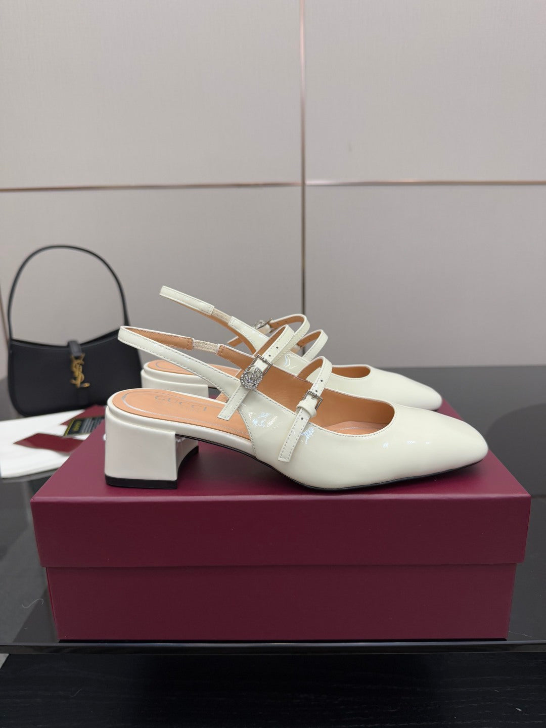 Gucci ladies' white slingback pumps with jeweled T-strap on block heel.