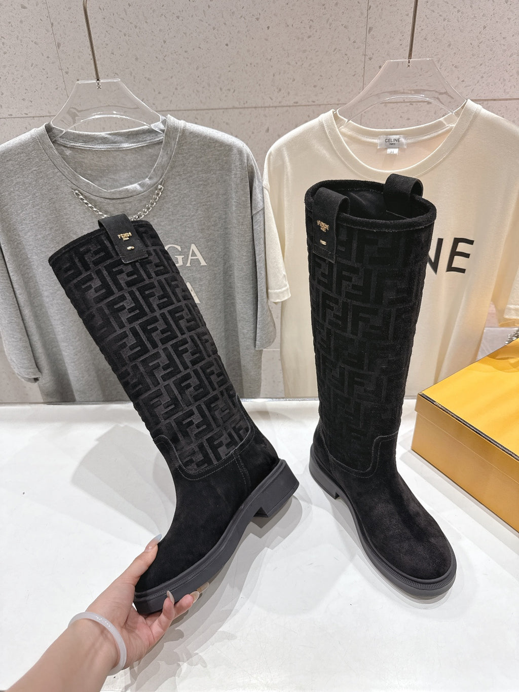 Black FF knee-high boots with cuff strap detail and low profile sole