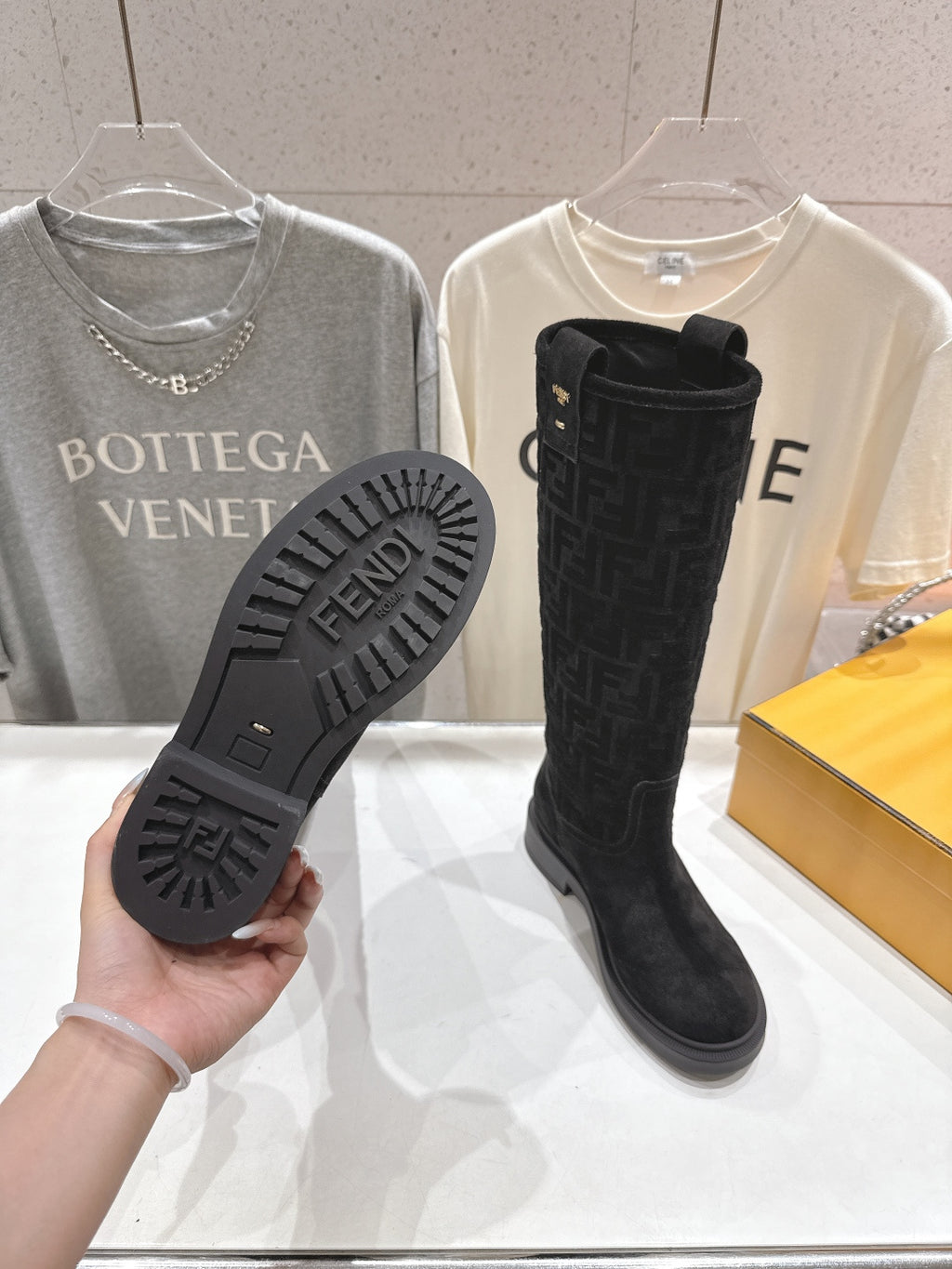 Black knee-high boot sole with Fendi logo tread and FF upper detail