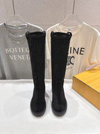 Women's black Fendi knee-high boots with FF pattern, pull-on style
