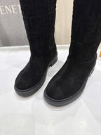 Black knee-high boots with stitched panels and flat, grippy sole