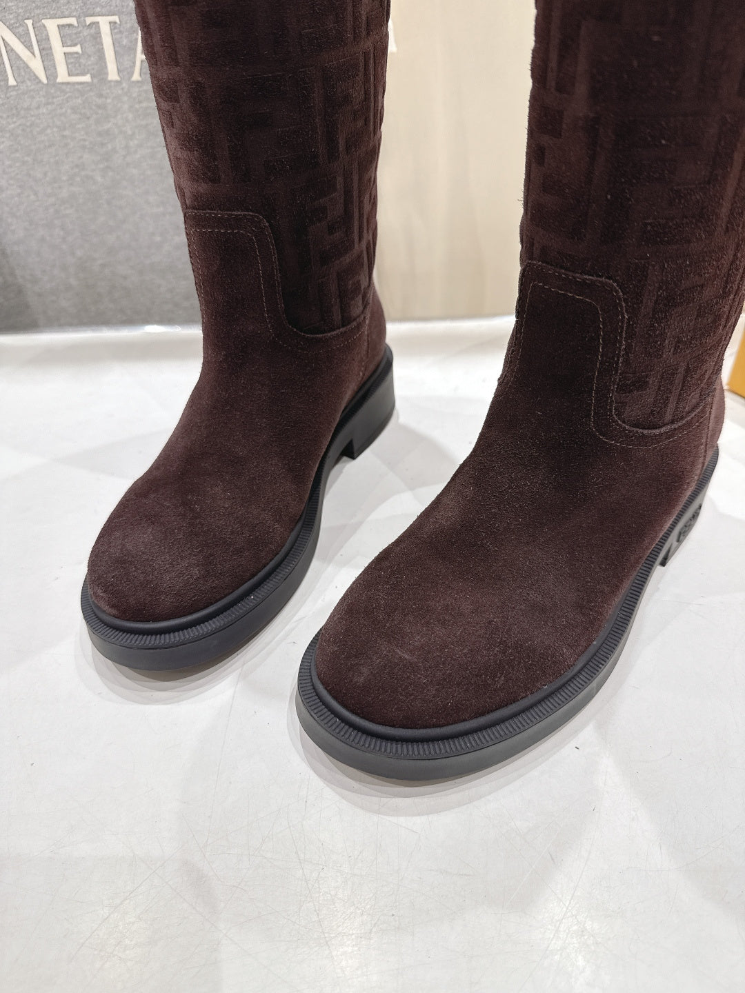 Burgundy tall boots with rubber sole and stitched side panel detail