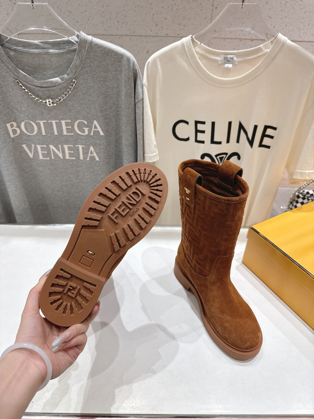 Brown Fendi boot outsole tread, textured rubber bottom close-up