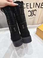 Black Fendi mid-calf boots with tall cuff, FF monogram sides, and platform sole