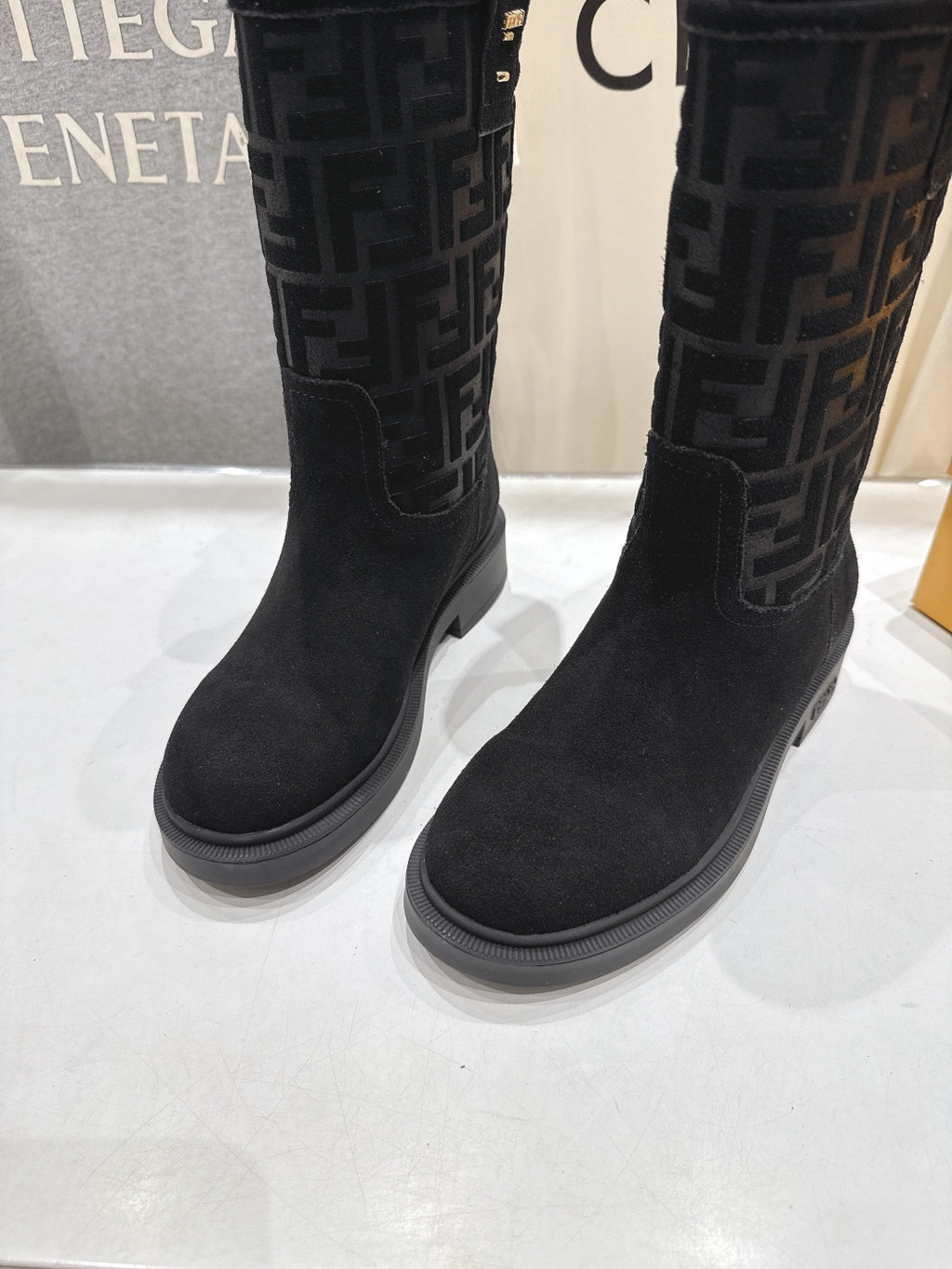 Black Fendi mid-calf boots with FF monogram side panels and rubber sole