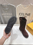 Brown suede ankle boots with textured rubber sole and embossed Fendi logo