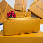 Yellow leather-look tote bag with diamond-stitched front panel and structured top edge