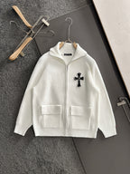 White long-sleeve zip jacket with cross applique and chest flap pockets
