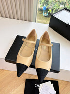 Chanel two-tone flats with pointed toe, beige upper and black toe panels