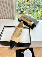 Two-tone flats with pointed toe and ankle strap, beige leather with black panels