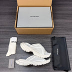 Balenciaga white sporty slide sandals, side profile view of pair