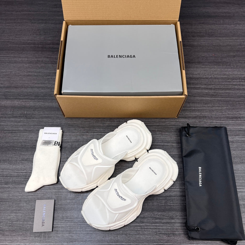 Balenciaga white sporty slide sandals with wide straps, pair shown