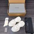 Balenciaga white sporty slide sandals with wide straps, pair shown