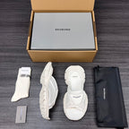 Balenciaga white sporty slide sandals, side and back views shown