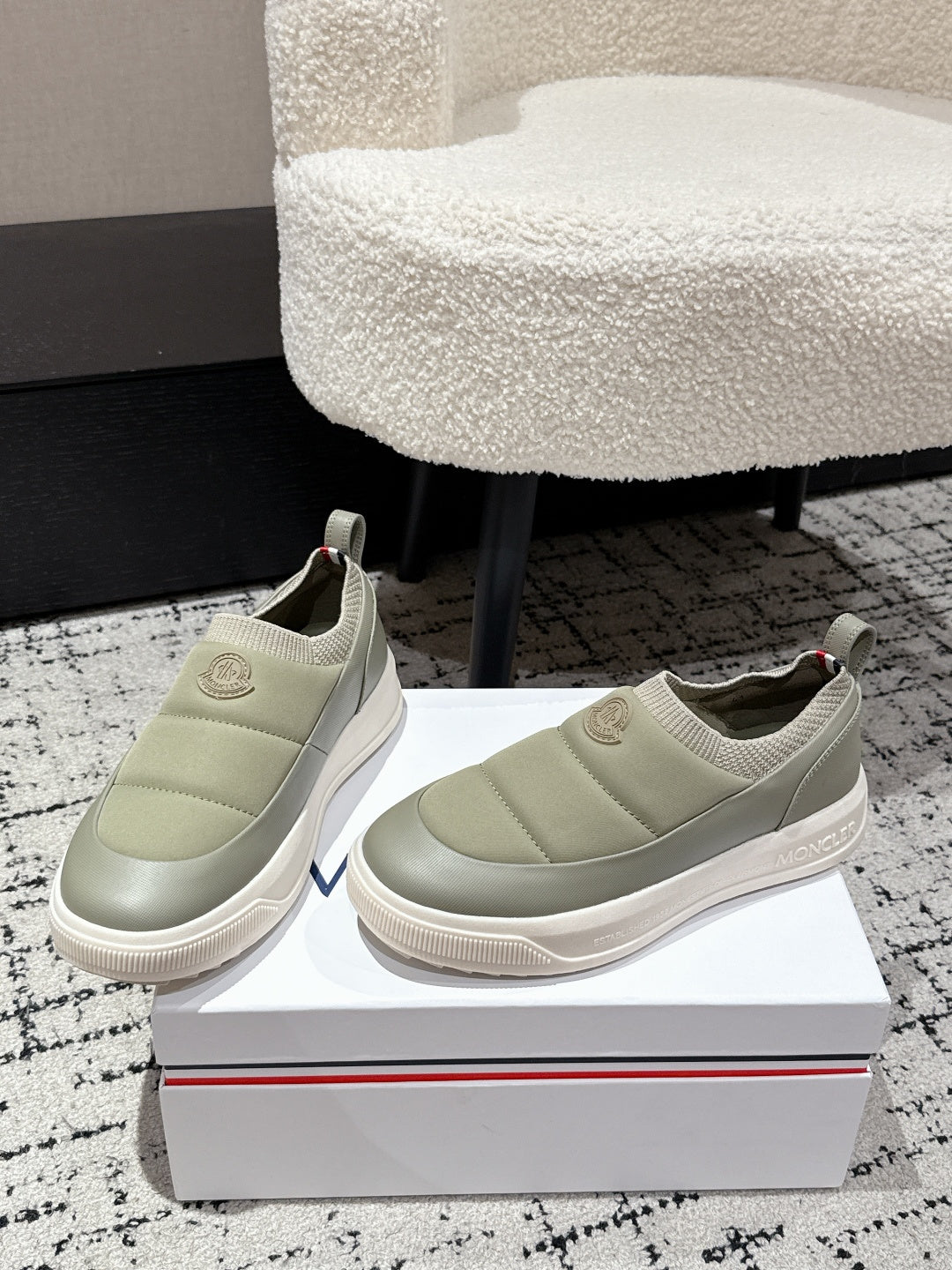 Moncler slip-on sneakers in light olive with elastic gore and textured rubber sole.