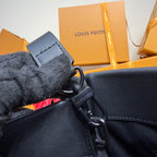 Louis Vuitton leather bag zipper area, navy blue, carabiner and fabric pull tab