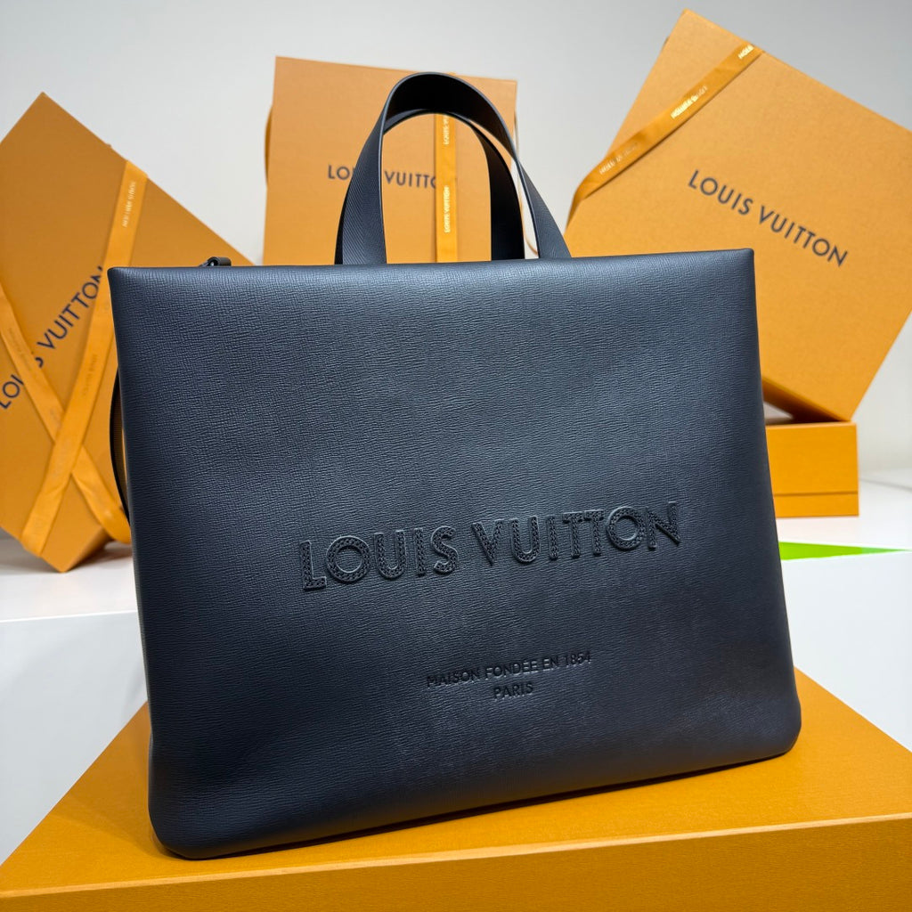 Navy Louis Vuitton tote bag with front Louis Vuitton logo and top handles