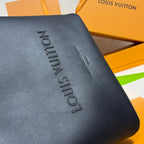 Louis Vuitton leather bag corner, navy blue, embossed vertical Louis Vuitton lettering