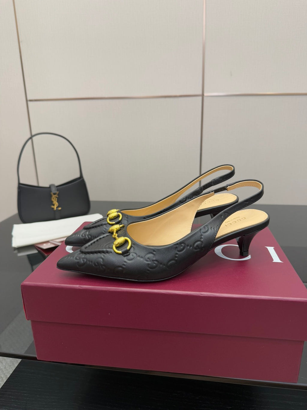 Women's Gucci black slingback loafers with gold horsebit detail