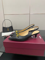 Women's Gucci black slingback loafers with gold horsebit detail