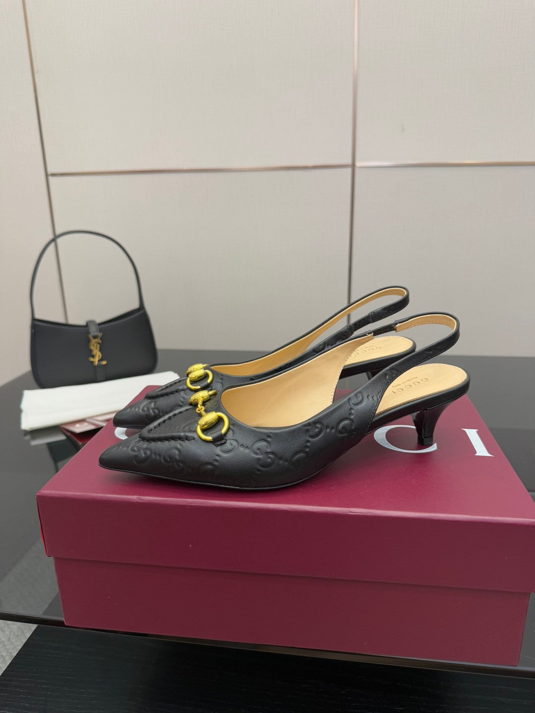 Women's Gucci black slingback loafers with gold horsebit detail